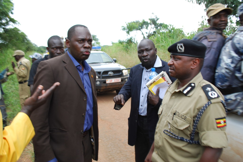 Kilak County MP Olanya Gilbert (left), Christopher Lakony (middle) face off with the northern regional police commander Paul Nkore (right) in Apaa last Monday. Photo by Sam Lawino