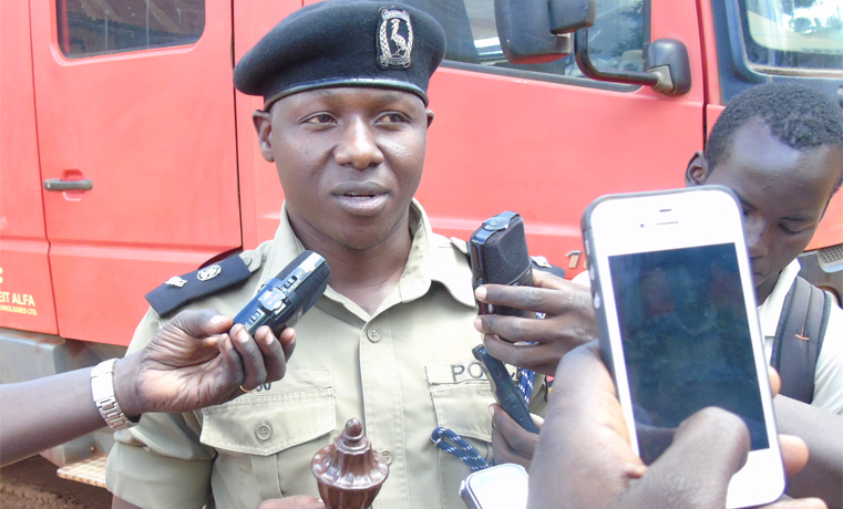 Martin Okoyo, the District Police Commander Gulu displaying fake bomb to Press on Wednesday