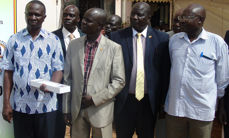 Lands Minister Daudi Migereko standing (Extreme right) with Acholi Leaders during launch of National ID in Gulu recently