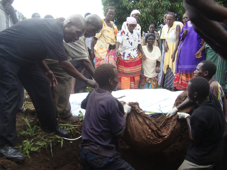 Lukodi LRA’s Massacre Survivors exhuming the bodies of their loved Ones buried in Shallow Graves for Reburial in 2013. Photo by James Owich