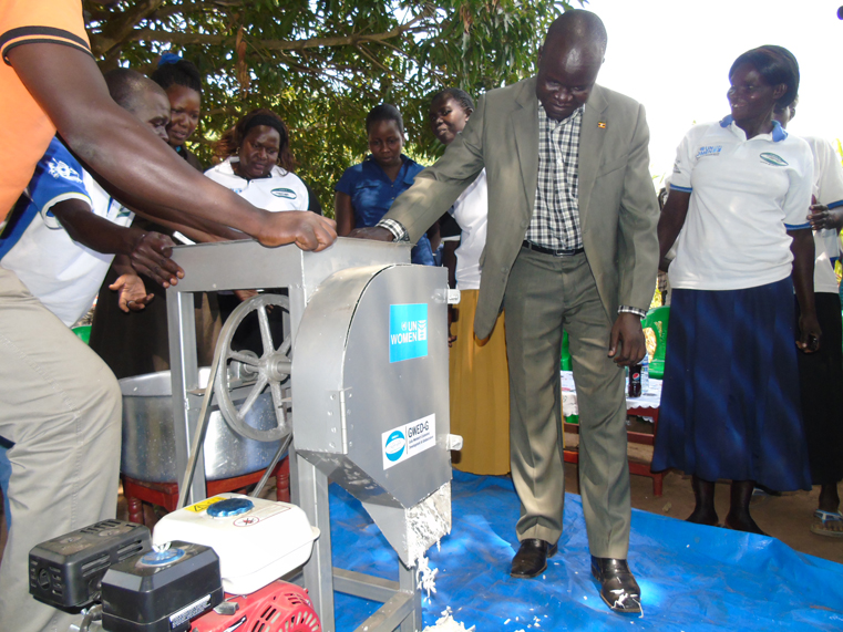 Gulu District LCV Chairman Martin Ojara Mapenduzi testing the cassava chipper machine donated to farmers’ group in Lapeta village, Unyama Sub County in Gulu district recently. Photo by James Owich