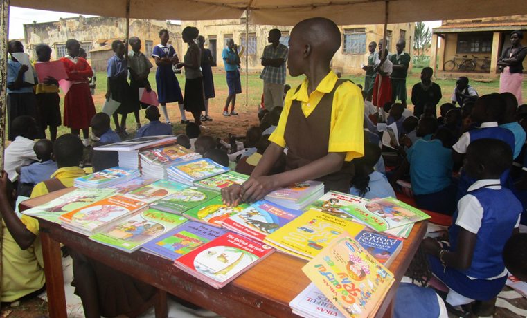 A pupil check a book for reading