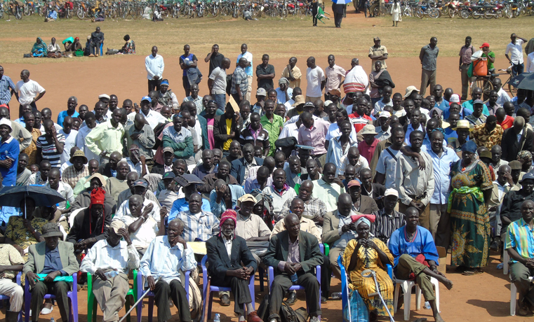 Members of Acholi War Debt Claimants’ Association under a scotching listening to the address of Justice Minister Kahinda Otaffire in February this year at Pece War Memorial Stadium in Gulu town (File Photo)