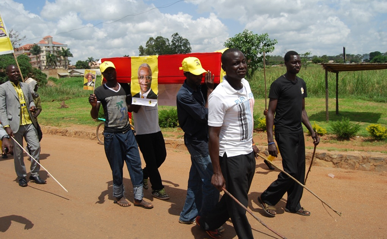 NRM youth opposed to Amama Mbabazi's proposed plans to contest for NRM presidential flag bearer come 2016 carry a mock coffin for Mbabazi in Gulu town. PHOTO BY DENIS OTIM