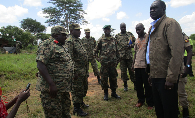 Col Stephen on the left explains to Minister Onek how they chased the South Sudanese