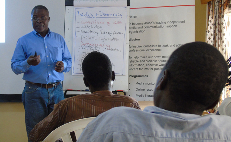 Dr. Peter Mwesige, a senior journalist trainer gestures during a training workshop on Election Reporting in Gulu town on Monday