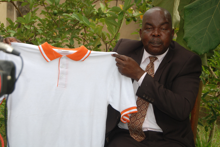 Gulu Mayor George Labeja shows off the Tshirt colour that he will be using for his campaign in the coming 2016 general lection