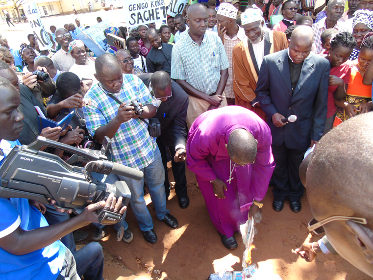 Rt. Rev. Johnson Gakumba, the bishop of Northern Uganda Diocese (cassock) accompanied by religious and cultural leaders from Acholi sets fire on waragi packed in sachets in protest on Thursday in Gulu