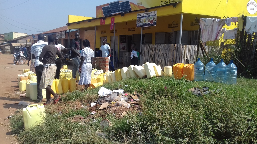 residents of Pece Vanguard in Pece Division que for water on Tuesday. for the past two weeks, the supply of water has been inadquate to residents within the unicipality. PHOTO BY DENIS OTIM
