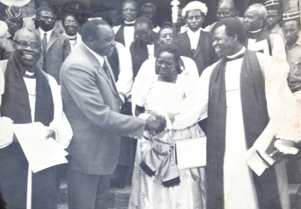 Former Ugandan presdient, Iddi Amin (l) greets the late  archbishop Luwum (r) as Mary (c) looks on.PHOTO BY TERENCE ALUR)