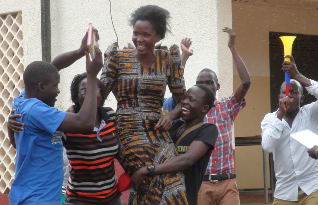 Nancy Atimango is lifted high by her supporters, soon after she was declared Guild President-Elect, Gulu University Kitgum Campus last Sunday.