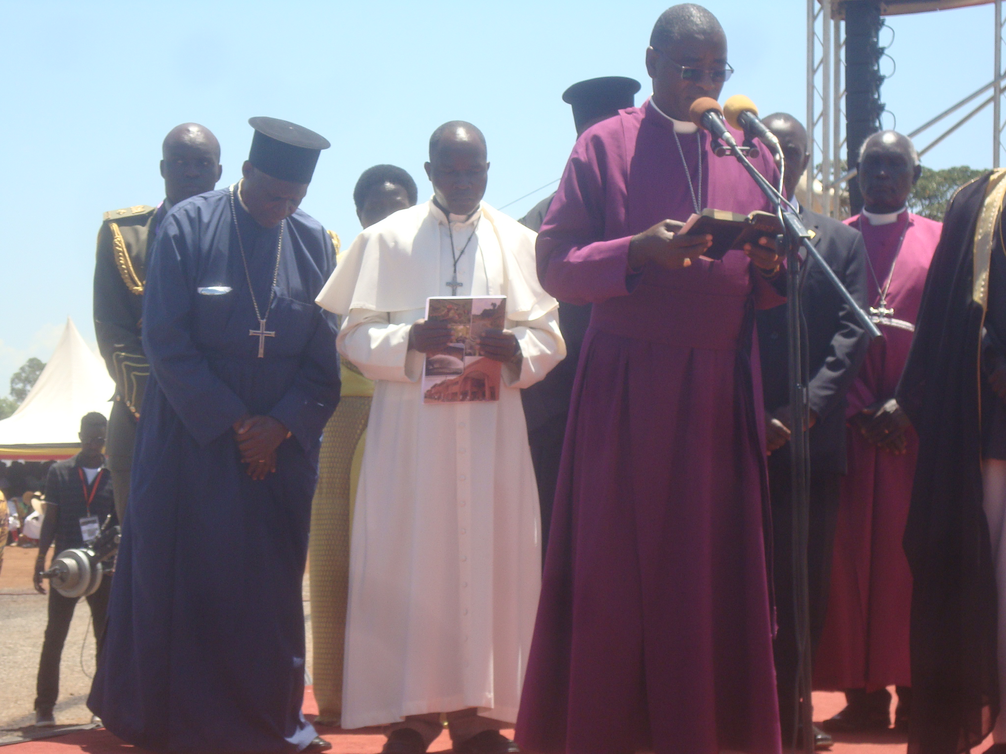 Father Erick in white (middle) during the 53rd independence commemoration in Gulu district